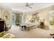 Spacious bedroom with plush carpet, ceiling fan and attached sitting area at 2769 Peachtree Ne Rd # 6, Atlanta, GA 30305