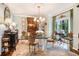 Formal dining room featuring a glass table, elegant chandelier, and stylish decor at 2769 Peachtree Ne Rd # 6, Atlanta, GA 30305