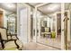 Carpeted dressing room with mirror paneled walls and closet doors at 2769 Peachtree Ne Rd # 6, Atlanta, GA 30305