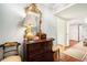 Entry foyer featuring hardwood floors, decorative mirror, and a charming antique chest at 2769 Peachtree Ne Rd # 6, Atlanta, GA 30305