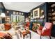 Inviting sitting room with a fireplace and large windows offering verdant views at 2769 Peachtree Ne Rd # 6, Atlanta, GA 30305