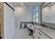 Bright bathroom with separate shower, double vanity and vintage soaking tub at 4640 Lambton Cir, Suwanee, GA 30024