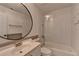 Cozy bathroom with a vanity, toilet, and shower/tub combo at 4640 Lambton Cir, Suwanee, GA 30024
