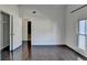 Bedroom featuring hardwood floors, a closet and window at 4640 Lambton Cir, Suwanee, GA 30024