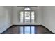 Bedroom featuring hardwood floors, a large window, and plenty of natural light at 4640 Lambton Cir, Suwanee, GA 30024