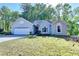 Well-maintained one-story home with a two car garage and manicured lawn at 4640 Lambton Cir, Suwanee, GA 30024