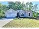 Charming one-story home with a two car garage and well-maintained landscaping at 4640 Lambton Cir, Suwanee, GA 30024