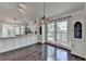 Eat-in kitchen features a breakfast bar, stainless steel appliances, and lots of light at 4640 Lambton Cir, Suwanee, GA 30024