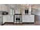 Kitchen with white cabinets, stainless steel appliances, and marble countertops at 4640 Lambton Cir, Suwanee, GA 30024