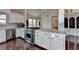 Kitchen with a stainless steel oven, white cabinetry, and marble countertops at 4640 Lambton Cir, Suwanee, GA 30024