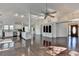 Open concept living area with hardwood floors, ceiling fan, and eat-in kitchen at 4640 Lambton Cir, Suwanee, GA 30024