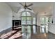Bright living room featuring hardwood floors, a fireplace, and an abundance of natural light at 4640 Lambton Cir, Suwanee, GA 30024