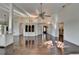 Bright living room with high ceilings, hardwood floors, and built-in shelving at 4640 Lambton Cir, Suwanee, GA 30024