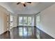 Spacious main bedroom with hardwood floors, many windows and ensuite bath at 4640 Lambton Cir, Suwanee, GA 30024