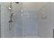 Walk in shower with white subway tiles and glass door at 4640 Lambton Cir, Suwanee, GA 30024