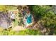 Aerial view of home with pool and jacuzzi in a wooded lot at 925 Upper Hembree Rd, Roswell, GA 30076