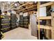 Unfinished basement with storage and shelving with open wood ceiling at 925 Upper Hembree Rd, Roswell, GA 30076