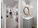 Well-lit bathroom with a modern vanity, stylish mirror, and easy access to the recreation area at 925 Upper Hembree Rd, Roswell, GA 30076