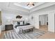 Beautiful bedroom featuring tray ceiling, neutral colors, and a comfortable king-sized bed at 925 Upper Hembree Rd, Roswell, GA 30076