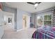 Spacious bedroom with gray walls, large windows, and an ensuite bathroom at 925 Upper Hembree Rd, Roswell, GA 30076