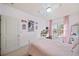 Bright bedroom featuring pink accents, natural light, and comfortable furniture at 925 Upper Hembree Rd, Roswell, GA 30076