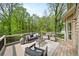 Relaxing outdoor deck with ample seating and serene wooded views at 925 Upper Hembree Rd, Roswell, GA 30076
