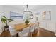 Bright dining room featuring a modern chandelier, hardwood floors, and stylish decor at 925 Upper Hembree Rd, Roswell, GA 30076