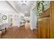 Elegant foyer with hardwood floors showcasing an open floor plan to the dining and living areas at 925 Upper Hembree Rd, Roswell, GA 30076