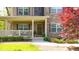 Inviting front porch and entrance showcasing stone detailing and attractive landscaping at 925 Upper Hembree Rd, Roswell, GA 30076