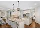 Well-equipped kitchen with an island, granite countertops, and stainless steel appliances at 925 Upper Hembree Rd, Roswell, GA 30076