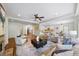 Spacious living room with hardwood floors flowing into an open kitchen and dining area at 925 Upper Hembree Rd, Roswell, GA 30076