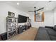 Relaxing living room featuring a large TV, comfortable seating, and stylish shelving at 925 Upper Hembree Rd, Roswell, GA 30076