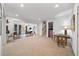 Bright and airy living room with plush carpeting and an open layout to other rooms at 925 Upper Hembree Rd, Roswell, GA 30076