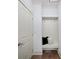 Convenient mudroom with built-in bench, storage, and hooks for organization at 925 Upper Hembree Rd, Roswell, GA 30076