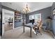 Comfortable home office with a view, ample storage, and easy access to the recreation room at 925 Upper Hembree Rd, Roswell, GA 30076