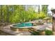 Backyard with pool, jacuzzi, patio, and luscious landscaping at 925 Upper Hembree Rd, Roswell, GA 30076