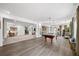 Spacious recreation room with stylish floors, pool table, and comfortable seating area at 925 Upper Hembree Rd, Roswell, GA 30076