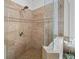 Close-up of the shower featuring designer tile and a frameless glass enclosure at 925 Upper Hembree Rd, Roswell, GA 30076