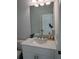 Bathroom featuring a modern vanity with granite countertops and decorative accessories at 102 Birch Tree Way, Cumming, GA 30040
