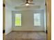 Bedroom with neutral carpet and natural light from two windows at 102 Birch Tree Way, Cumming, GA 30040