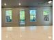 Bright kitchen showcasing marble counters, recessed lighting, and backyard views through multiple windows at 102 Birch Tree Way, Cumming, GA 30040