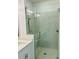 Modern shower with glass door, bench, and tiled walls at 102 Birch Tree Way, Cumming, GA 30040