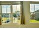 Windows offering a view of a residential area and lush green lawns at 102 Birch Tree Way, Cumming, GA 30040