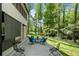 Cozy back patio with outdoor seating and scenic views of the surrounding wooded area at 105 Woodmeade Nw Way, Marietta, GA 30064