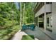 Cozy back patio offering outdoor seating area with a table and surrounded by lush greenery at 105 Woodmeade Nw Way, Marietta, GA 30064