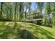 Spacious backyard featuring a deck, patio, and green lawn, perfect for outdoor activities and relaxation at 105 Woodmeade Nw Way, Marietta, GA 30064