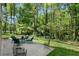 Expansive backyard patio with outdoor seating, ideal for entertaining and enjoying the natural surroundings at 105 Woodmeade Nw Way, Marietta, GA 30064