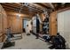 Basement gym featuring wood ceilings, exercise equipment, and ample storage space at 105 Woodmeade Nw Way, Marietta, GA 30064