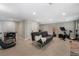This finished basement features a fireplace, exercise equipment, and bar at 105 Woodmeade Nw Way, Marietta, GA 30064