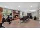 This basement features a fireplace and exercise equipment at 105 Woodmeade Nw Way, Marietta, GA 30064